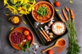 Top view of a table with dishes with beans, corn, tomatoes, parsley, garlic. Kitchen still life with sunflowers Royalty Free Stock Photo