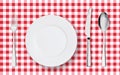 Top view of table place setting for dinner on red tablecloth with empty plate glasses and cutlery. Royalty Free Stock Photo