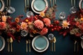 top view of a table with place settings, dinnerware, and flower centerpiece