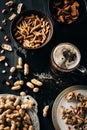 top view of table set with snacks and glass of beer on dark Royalty Free Stock Photo