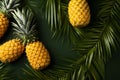 A top view tableau pineapple, tropical leaves, and yellow backdrop