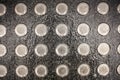 Metal tactile paving tiles for the blind. stainless steel stud of tactile paving. Top view of round protruding pimples placed on Royalty Free Stock Photo