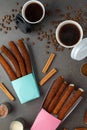 Top view of take away coffee next to chocolate filled and plain churros Royalty Free Stock Photo