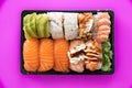 Top view of take away sushi package isolated on coloful background