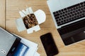 top view of takeout noodles for lunch, business documents, laptop and smartphone with blank screens Royalty Free Stock Photo