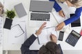 Top view of talking colleagues in office at white desk Royalty Free Stock Photo