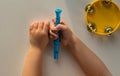 Top view of tambourine and child hands holding pipe on the white background Royalty Free Stock Photo