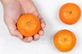 Top view of Tangerines in the hand