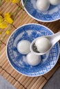 Top view of tangyuan in a bowl on gray background for lunar new year food