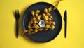 Top view of tape measurement on a black plate looking like food pasta with a white alarm clock.Diet concept healthy lifestyle Royalty Free Stock Photo