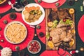 Top view of tasty baked roasted whole fried chicken and salad with christmas decoration on the christmas themed dinner table Royalty Free Stock Photo