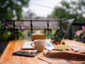 Top view of a creamy cupcake with cofee on the wooden table. Food concept.