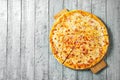 Top view tasty cheese italian pizza on wooden table