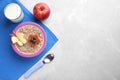 Top view of tasty porridge served with apple and milk on marble table. Kids breakfast idea Royalty Free Stock Photo