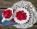 Top view of tasty, red raspberries in white plate and pitcher Royalty Free Stock Photo