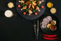 top view of tasty roasted potatoes with chicken wings, sauces, vegetables and glass of beer Royalty Free Stock Photo