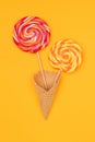 top view of tasty round lollipops in waffle cone