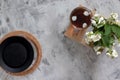 Top view. A tea pot with a black lid and a cup of tea stand on a white table Royalty Free Stock Photo