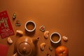 Top view of tea set, tangerines and traditional chinese decorations Royalty Free Stock Photo