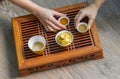 Top view tea set wooden table for tea ceremony background. Woman and child holding a cup of tea Royalty Free Stock Photo