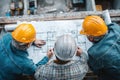 Top View Team Meeting Over Construction Blueprints and Plans Royalty Free Stock Photo