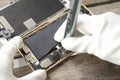 Top view, technician fixing a smartphone