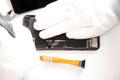 top view, technician fixing a smartphone