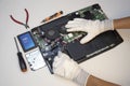 Top view. Technician repairing notebook computer, repairing motherboard and circuit