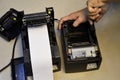 Top view. Technician repairing printer, thermal printer Royalty Free Stock Photo