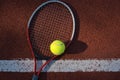 Tennis ball, racquet on hard court surface Royalty Free Stock Photo