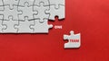 Top view of text - one team. On red background of white jigsaw missing pieces. Business concept. Royalty Free Stock Photo