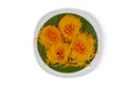 Top view of Thai dessert Golden Egg yolk threads Foi Thong and Golden drop Thong Yot in white plate on white background.