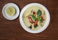 Top view Thai food chicken green curry on wooden table