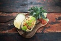 Top view Thai food pineapple chicken fried rice on rustic wooden table