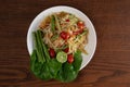 Top view Thai food rice noodle papaya salad on wooden table