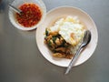 Top view of Thai local stir fried chicken with holy basil. with deep fried egg, with fish sauce