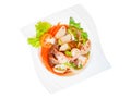Top view,Thai pork sausage salad.shrimp, carrots, red peppers, onions, squid, in the plate isolated white background Royalty Free Stock Photo