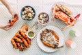 Top view of Thai Seafoods are Grilled Prawns Shrimps in the shell, Steamed crabs, grilled Laevistrombus Canarium, Grilled Squid. Royalty Free Stock Photo