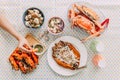 Top view of Thai Seafoods are Grilled Prawns Shrimps in the shell, Steamed crabs, grilled Laevistrombus Canarium, Grilled Squid. Royalty Free Stock Photo