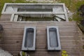 Top view of the thermal baths on a wooden platform overlooking the river and Swiss nature