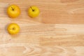 Top view of three apples with copyspace on a wooden table Royalty Free Stock Photo