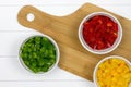 Top-view of three bowls filled with sliced paprikas Royalty Free Stock Photo