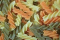 Top View of Three-Color Spiral Shaped Pasta Fusilli, for Background Royalty Free Stock Photo