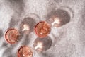 Top view of three crystal glasses of rose sparkling wine or champagne on grey stone background in hard light with