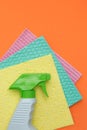 Three sponges and a bottle of spray for cleaning Royalty Free Stock Photo