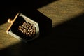 Top view of three different varieties of coffee beans on dark b Royalty Free Stock Photo
