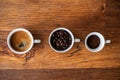 Top view of three different varieties of coffee on wooden background Royalty Free Stock Photo