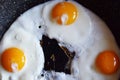 Top view of three eggs frying on pan. Royalty Free Stock Photo