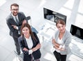 Top view. three employees standing in the office