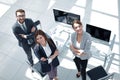 Top view. three employees standing in the office